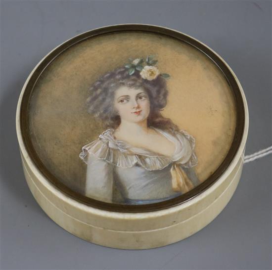 A 19th century ivory snuff box with painted lid